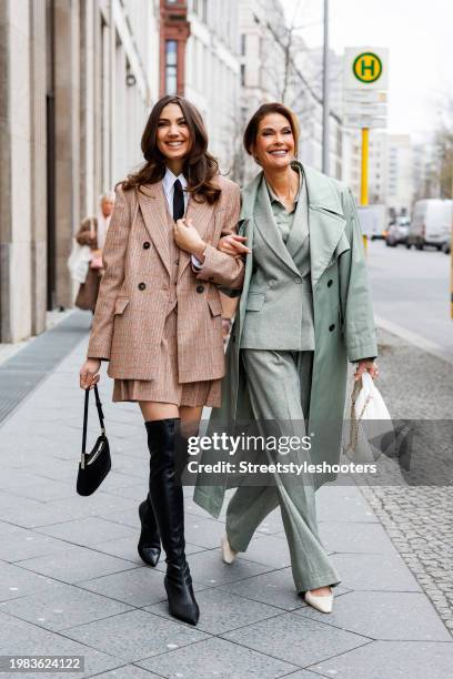 Actress Emerson Tenney, wearing a full look by Marc Cain, with her mother US actress Teri Hatcher, wearing a full look by Marc Cain, during the...