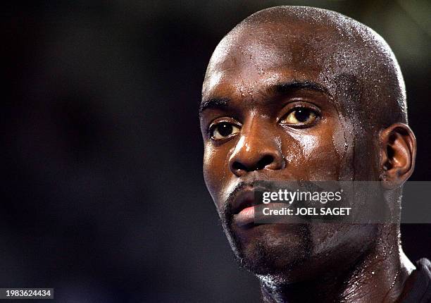 Pascal Gentil of France waits after winning the bronze medal of the men's over 80 kg taekwondo finals 29 August 2004 at the Sports Pavilion in Athens...