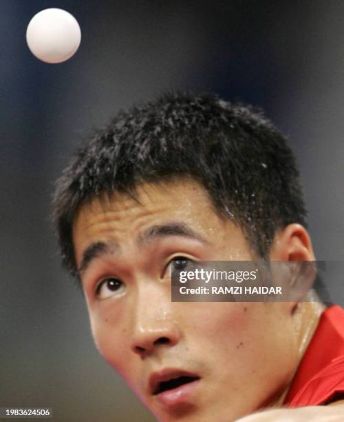 China's Wang Liqin eyes the ball during his match against Walden Jan-Ove of Sweden in the Men's singles bronze medal match at the Galatsi Olympic...