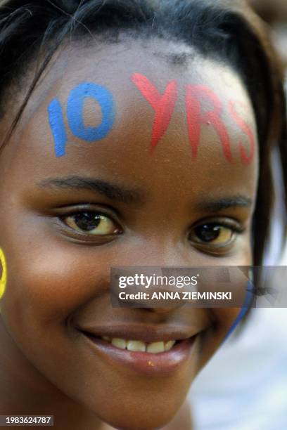 Young girl celebrates 10 years of democracy at a concert at the Union Buildings, Pretoria 27 April 2004 after the inauguration of South African...