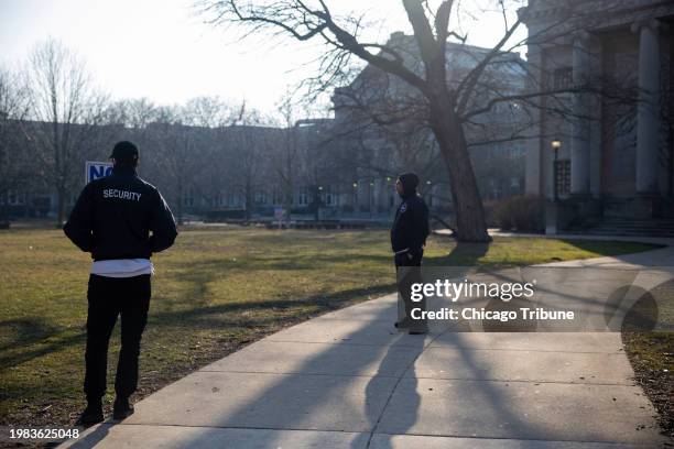 Chicago Public Schools security guards patrol the campus at Senn High School in Chicago on Feb. 1 the day after three students were shot, one fatally.