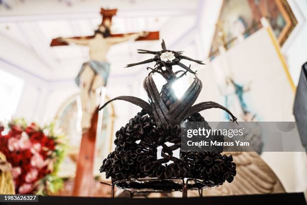 An artisanal crown that Lucio Olmos Morales fashioned out of vanilla bean stalk, is on display at the downtown church in Papantla, Mexico, Thursday,...