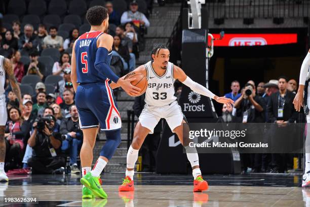 Tre Jones of the San Antonio Spurs plays defense against the Washington Wizards on January 29, 2024 at the Frost Bank Center in San Antonio, Texas....