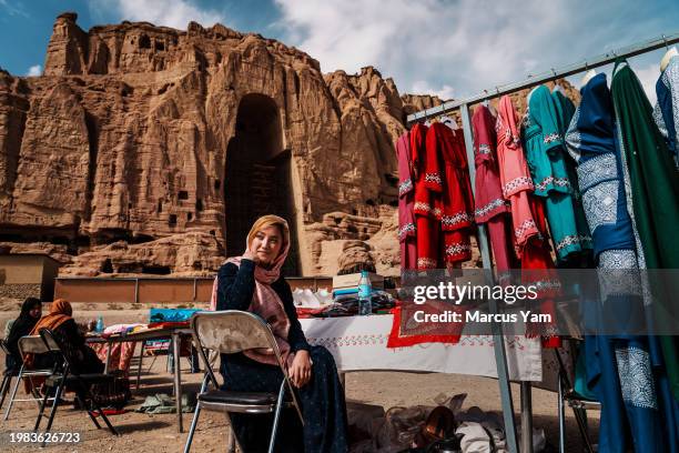 Narges Razuli works in a makeshift outdoor bazaar, in Bamyan, Afghanistan, Saturday, Sept. 24, 2022. Razuli works hard to take daily English classes...