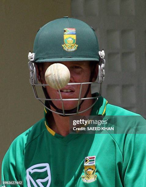 South African cricketer Shaun Pollock eyes a ball during a practice session at the Warner Park ground in Saint Kitts, 23 March 2007. South African...