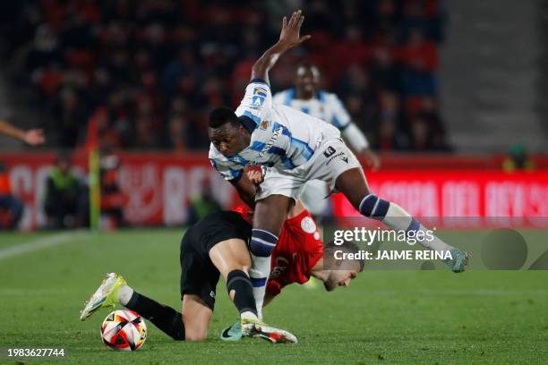 Real Sociedad's Nigerian forward Umar Sadiq vies with Real Mallorca's Spanish defender Jose Manuel Copete during the Spanish Copa del Rey semi final...