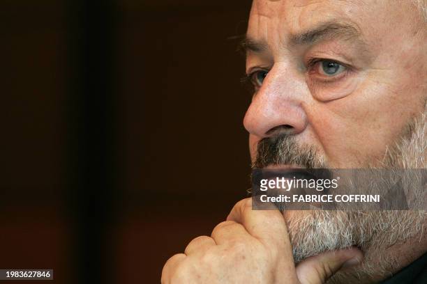 Phonak cycling team owner Andy Rihs gestures during a press conference while announcing 15 August 2006 in Zurich that the Swiss team will disband at...