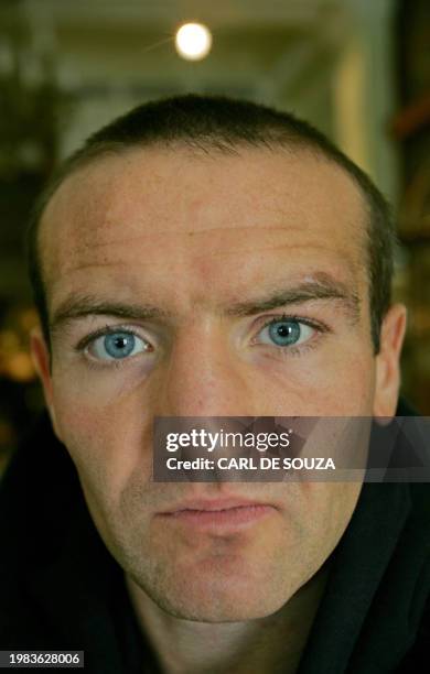 Featherweight Champion Scott Harrison prepares to address a press conference at the Park Lane Hotel, in central London, 23 November 2006. Harrison...