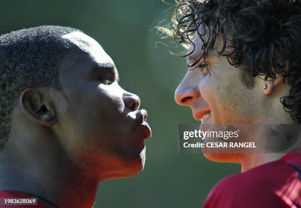 Barcelona's Samuel Eto'o of Cameroon Jokes with Thiago Motta of Brazil during a training session in Camp Nou Stadium in Barcelona 25 September 2006,...