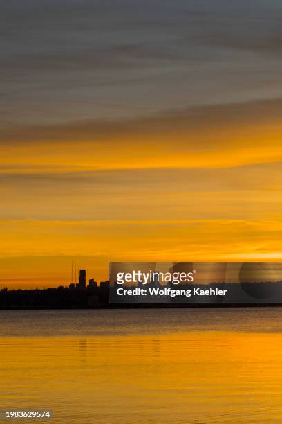 View of Seattle and Lake Washington at sunset from David E. Brink Park in Kirkland, Washington State, USA.