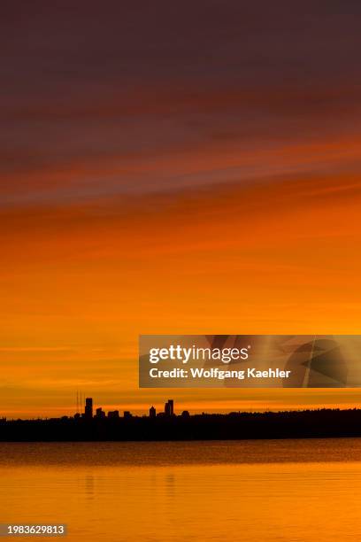 View of Seattle and Lake Washington at sunset from David E. Brink Park in Kirkland, Washington State, USA.