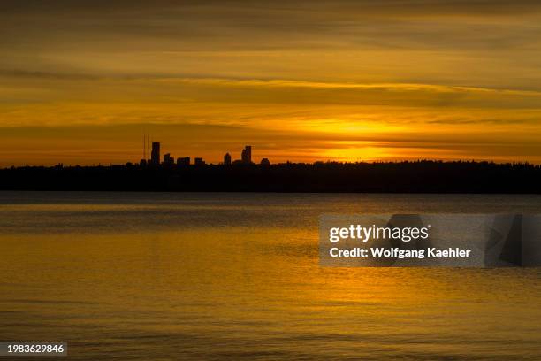 View of Seattle and Lake Washington at sunset from David E. Brink Park in Kirkland, Washington State, USA.