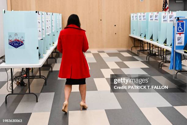 Voter prepares to cast a ballot on an electronic voting machine inside a vote center on Election Day during the Nevada 2024 presidential primary...