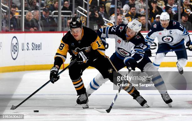 Jesse Puljujarvi of the Pittsburgh Penguins skates against Mason Appleton of the Winnipeg Jets at PPG PAINTS Arena on February 6, 2024 in Pittsburgh,...