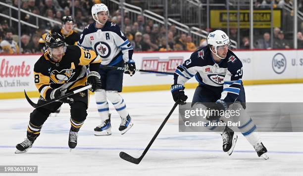 Sean Monahan of the Winnipeg Jets skates in the second period of his Jets debut during the game against the Pittsburgh Penguins at PPG PAINTS Arena...