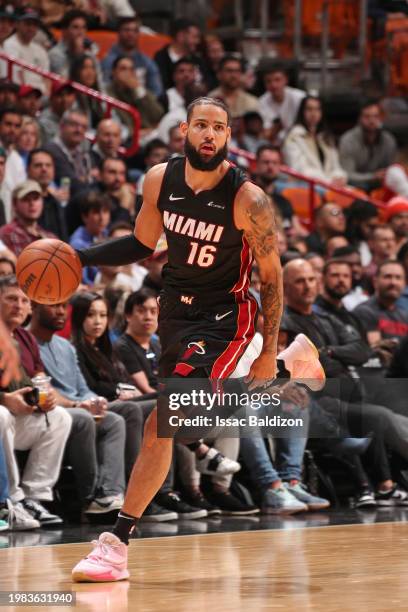 Caleb Martin of the Miami Heat dribbles the ball during the game against the Orlando Magic on February 6, 2024 at Kaseya Center in Miami, Florida....