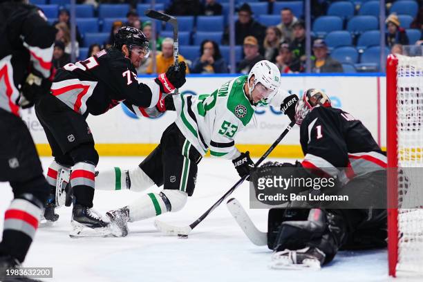 Ukko-Pekka Luukkonen and Connor Clifton of the Buffalo Sabres defend against Wyatt Johnston of the Dallas Stars during an NHL game on February 6,...