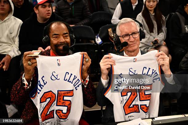 Walt Frazier and Mike Breen pose for a photo on their 25 anniversary of broadcasting during the game between the Memphis Grizzlies and the New York...