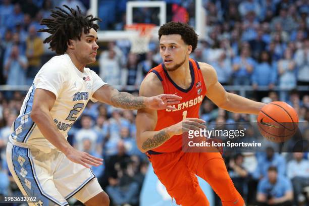 Clemson Tigers guard Chase Hunter drives as North Carolina Tar Heels guard Elliot Cadeau defends during the college basketball game between the North...