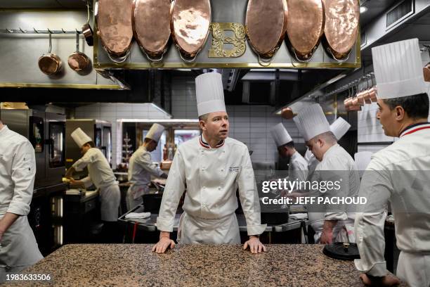 French chef Gilles Reinhardt looks on in the kitchen of the Auberge de Collonges restaurant, in Collonges au Mont d'Or on January 26, 2024. The...