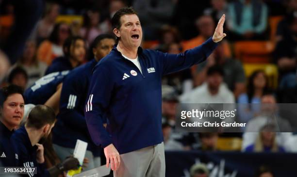 Head coach Steve Alford of the Nevada Wolf Pack calls for a play during the first half of their game against the Utah State Aggies at the Dee Glen...