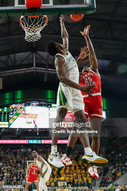 Baylor Bears center Yves Missi blocks a shot by Texas Tech Red Raiders forward Robert Jennings during the Big 12 college basketball game between...