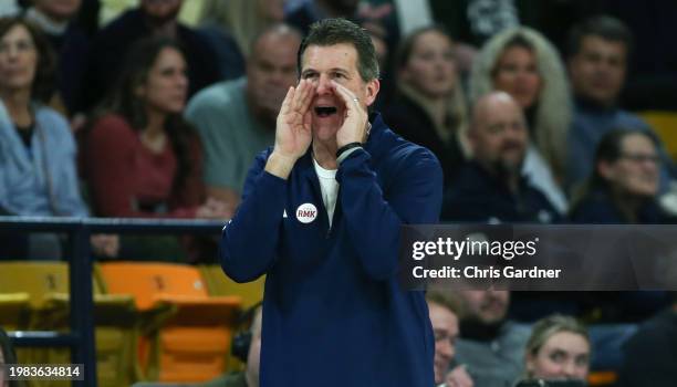 Head coach Steve Alford of the Nevada Wolf Pack calls for a play during the second half of their game against the Utah State Aggies at the Dee Glen...