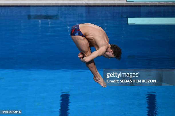 Britain's Ross Haslam competes in the semi-final of the men's 3m springboard diving event during the 2024 World Aquatics Championships at Hamad...