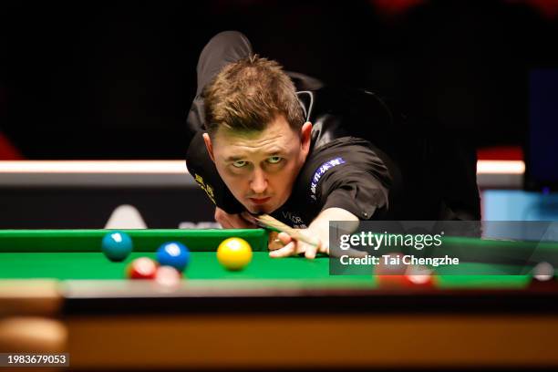 Kyren Wilson of England plays a shot in the Semi-final match against Si Jiahui of China on day 6 of 2024 BetVictor German Masters at Tempodrom on...