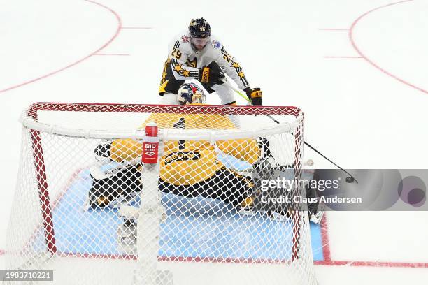 Jeremy Swayman of the Boston Bruins makes a save against Leon Draisaitl of the Edmonton Oilers during the game between Team Matthews and Team McDavid...