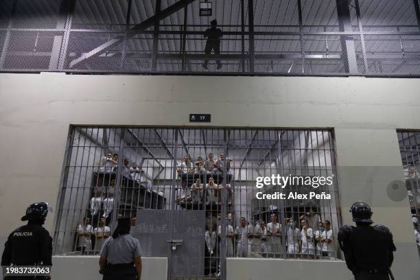 Officers in riot gear stand on patrol inside a cell at CECOT in Tecoluca on February 6, 2024 in San Vicente, El Salvador. On February of 2023 El...
