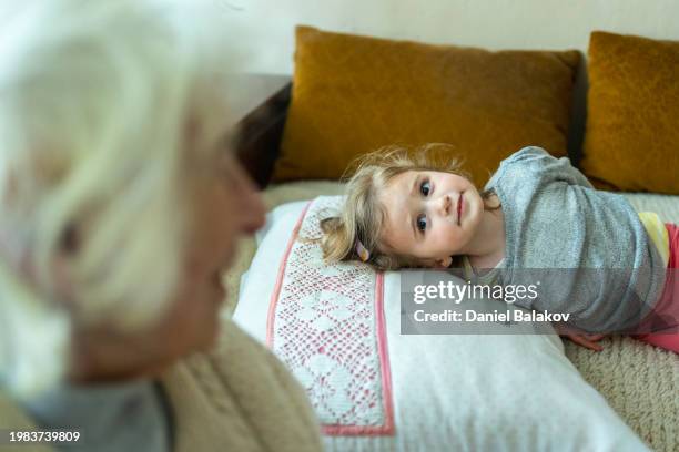 great grandma plays with toddler at home. - great grandmother stock pictures, royalty-free photos & images