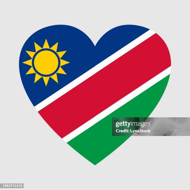 national flag of namibia. heart shape - namibian cultures stock illustrations