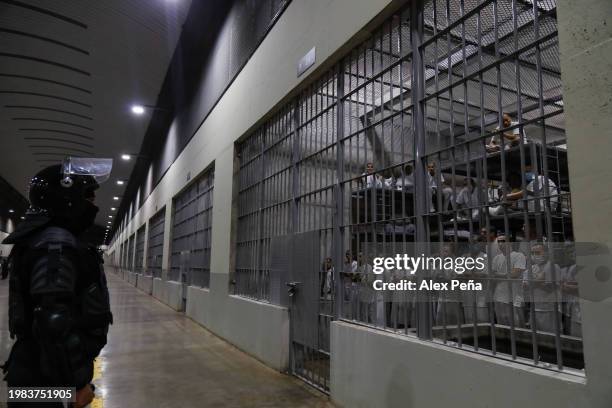 An officer in riot gear stands on patrol inside a cell at CECOT in Tecoluca on February 6, 2024 in San Vicente, El Salvador. On February of 2023 El...