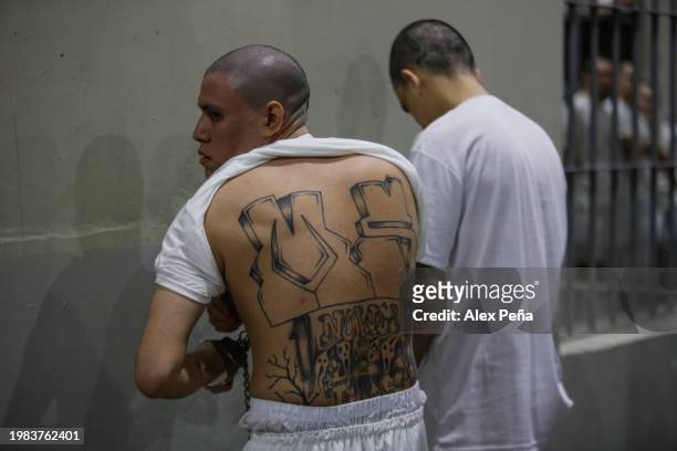 An inmate displays his back tattoos at CECOT in Tecoluca on February 6, 2024 in San Vicente, El Salvador. On February of 2023 El Salvador inaugurated...