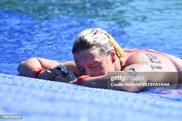 Netherlands' Sharon Van Rouwendaal catches her breath after winning the final of the women's 5km open water swimming event during the 2024 World...