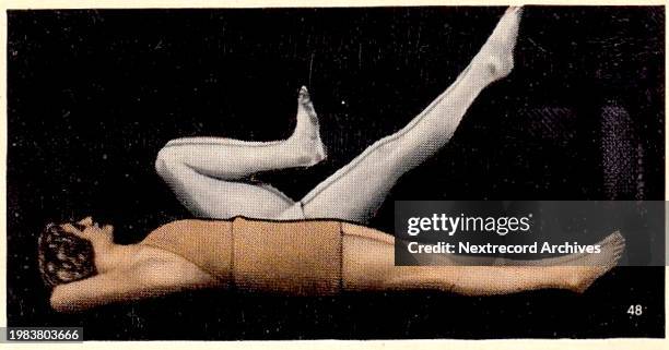 Collectible illustrated tobacco or cigarette card, 'National Fitness' series, published in 1938 by Ardath Tobacco Company, depicting a female athlete...