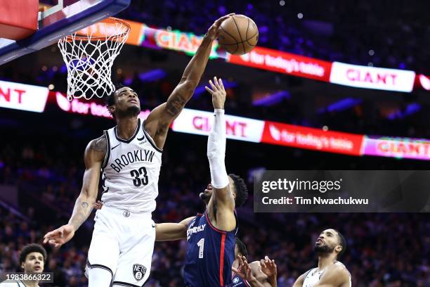 Nic Claxton of the Brooklyn Nets blocks KJ Martin of the Philadelphia 76ers during the third quarter at the Wells Fargo Center on February 03, 2024...