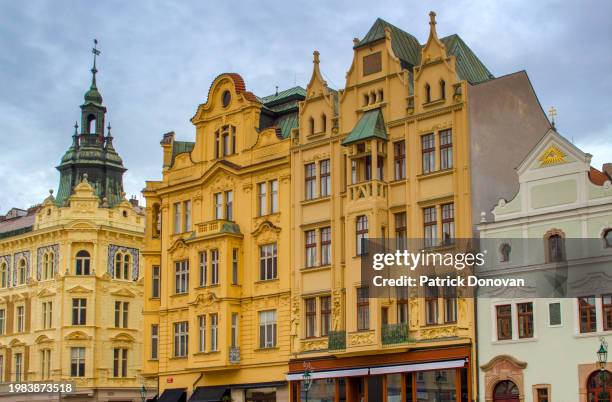 ornate facades on namesti republiky, plzen, czechia - illuminati stock pictures, royalty-free photos & images