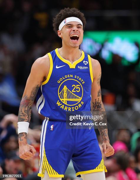 Lester Quinones of the Golden State Warriors reacts after hitting a three-point basket as time expired the first quarter against the Atlanta Hawks at...