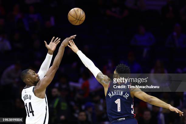 Harry Giles III of the Brooklyn Nets shoots over KJ Martin of the Philadelphia 76ers during the fourth quarter at the Wells Fargo Center on February...