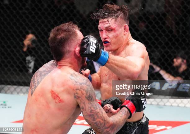 Drew Dober punches Renato Moicano of Brazil in a lightweight fight during the UFC Fight Night event at UFC APEX on February 03, 2024 in Las Vegas,...