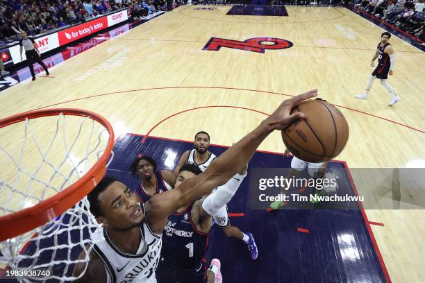 Nic Claxton of the Brooklyn Nets blocks KJ Martin of the Philadelphia 76ers during the third quarter at the Wells Fargo Center on February 03, 2024...