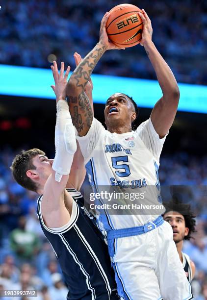 Armando Bacot of the North Carolina Tar Heels drives to the basket against Kyle Filipowski of the Duke Blue Devils during the second half of the game...