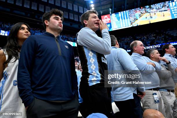 Sam Howell of the Washington Commanders, left, and Drake Maye, both former North Carolina Tar Heels quarterbacks, watch the game against the Duke...