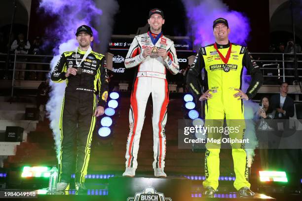 Denny Hamlin, driver of the Sport Clips Haircuts Toyota, winner Kyle Busch, driver of the Morgan & Morgan Chevrolet, second place and Ryan Blaney,...