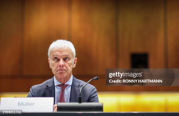 Former CEO of German carmaker Volkswagen Matthias Mueller waits for his testimony to begin at the model case proceedings in Germany against German...