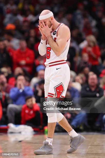 Alex Caruso of the Chicago Bulls reacts against the Sacramento Kings during the second half at the United Center on February 03, 2024 in Chicago,...