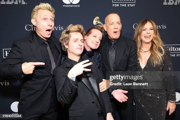 Mike Dirnt, Billie Joe Armstrong, and Tré Cool of Green Day, and Tom Hanks and Rita Wilson attend the Pre-GRAMMY Gala & GRAMMY Salute to Industry...