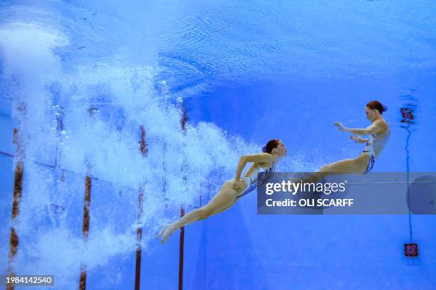 New Zealand's Nina Brown and Eva Morris compete in the preliminary round of the women's duet free Group B artistic swimming event during the 2024...